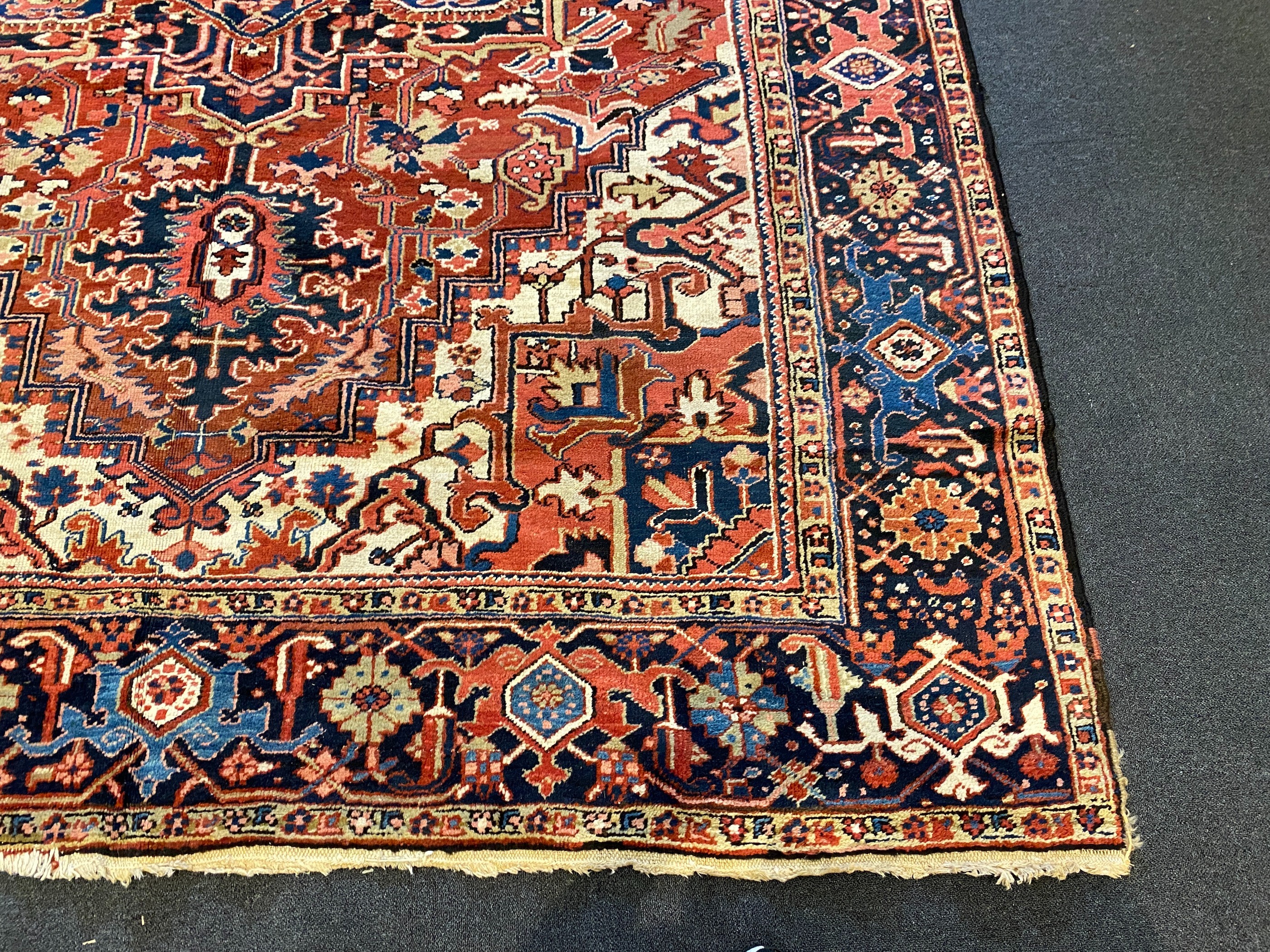 An Heriz red ground carpet, 364 x 265cm